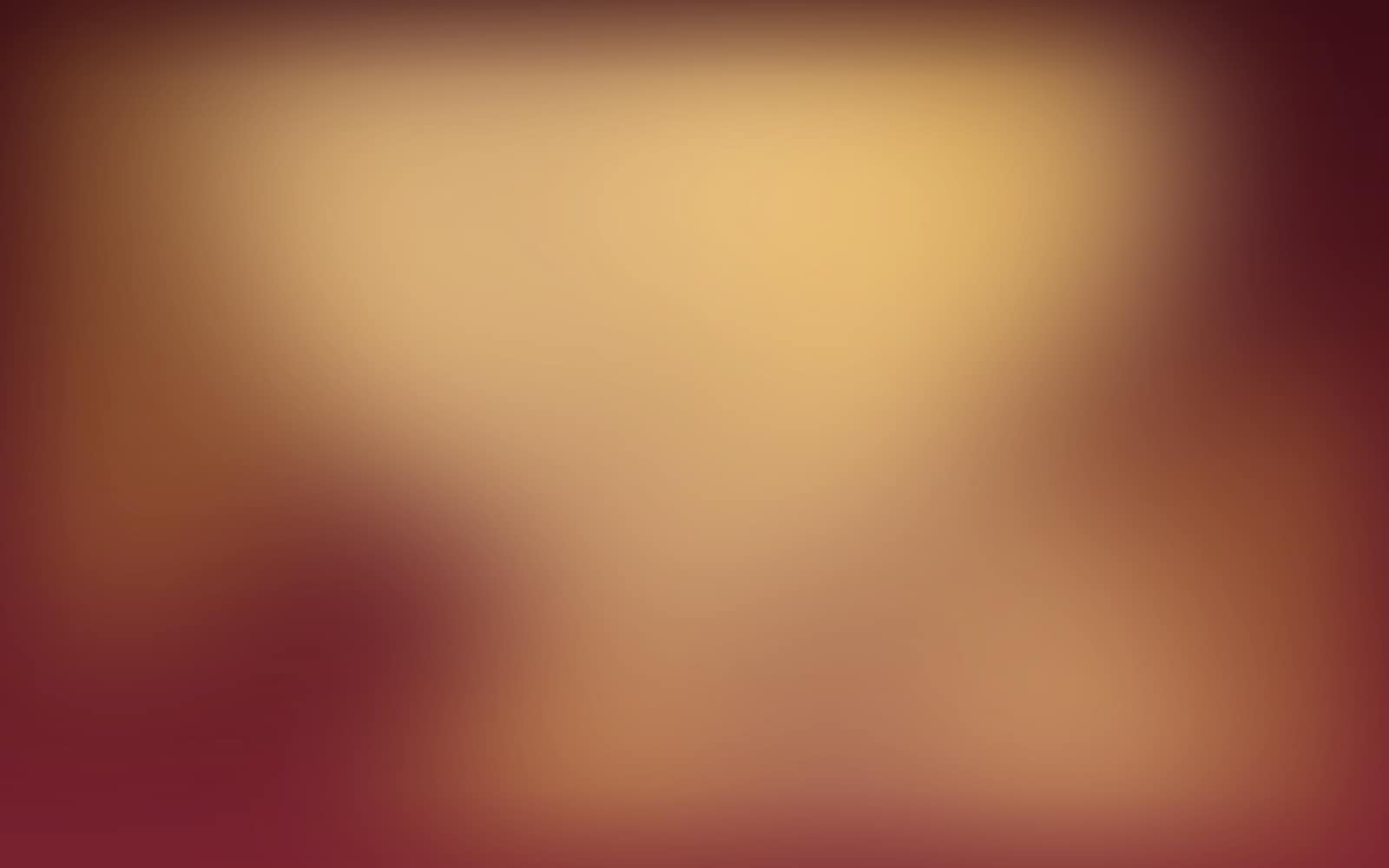 A dinner table laid in gold and deep red